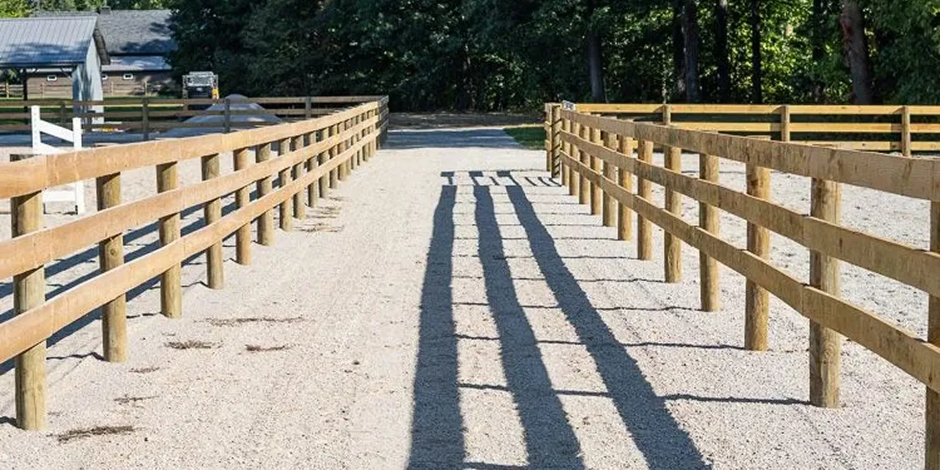 Long board-fence lane installed by Doughty Fence Builders